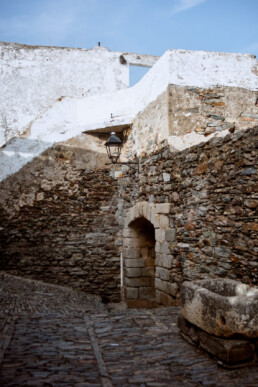 stone buildings and pavement in the historic hilltop village of monsaraz